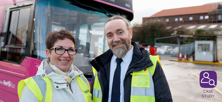 customers standing in front of pink electric bus