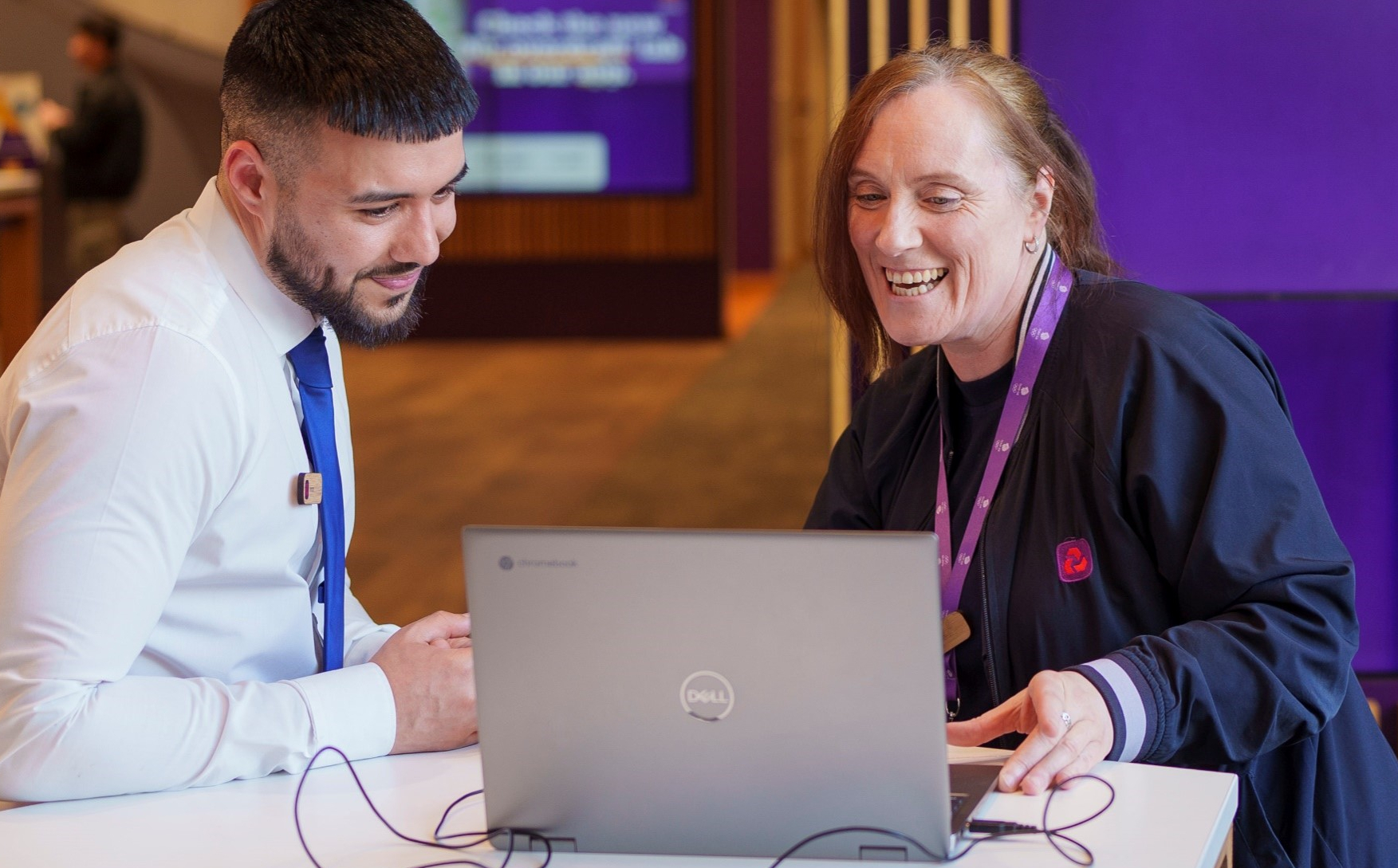 two colleagues with laptop in NatWest branch